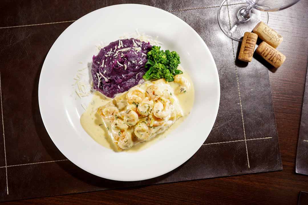 Robalo ao leite de coco com camarões. Foto: Victor Rocha