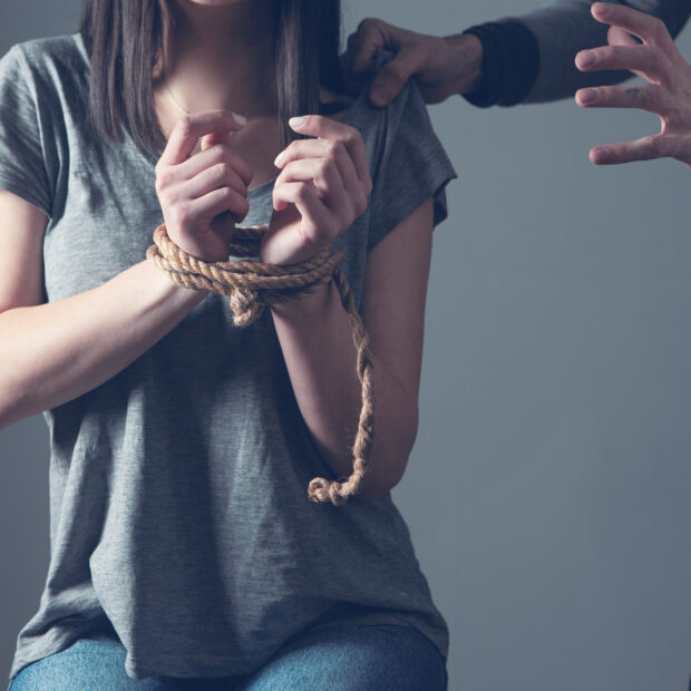 the man tied the woman's hands. concept of violence