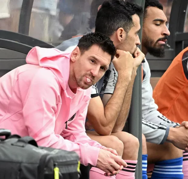 105783084 miamis argentine forward lionel messi blows gum while looking on from the bench durin