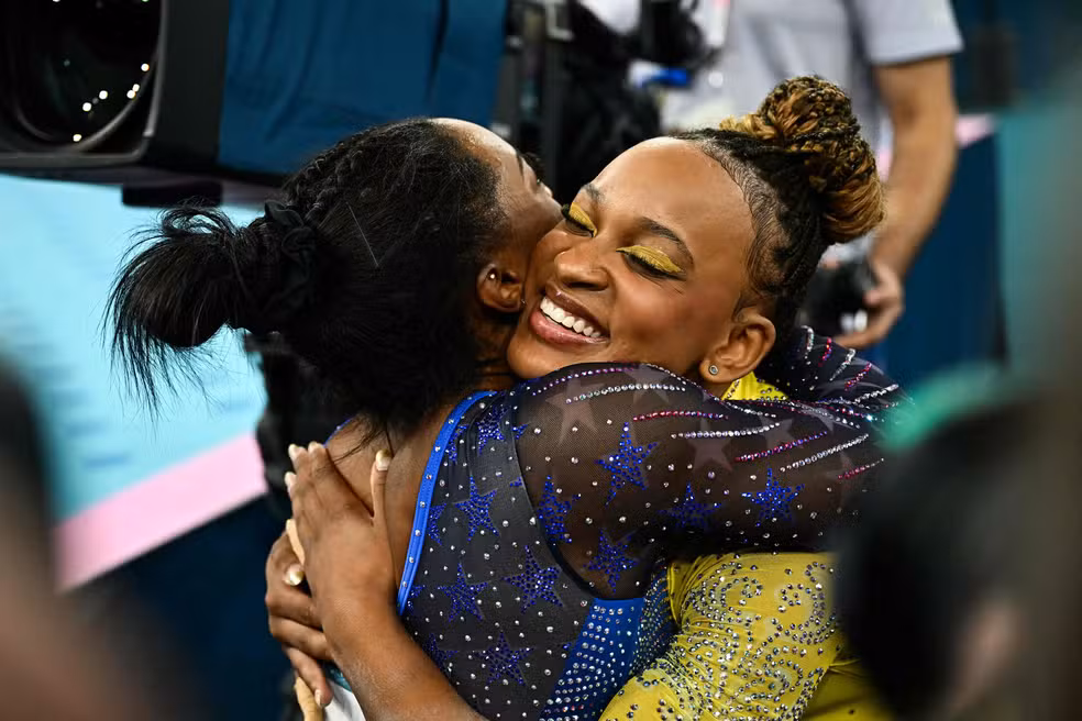 107940958 winner us simone biles l hugs second placed brazils rebeca andrade at the end of the
