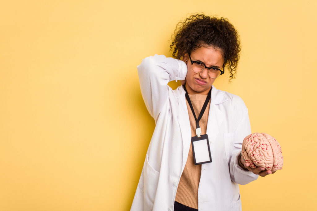 touching back of head, thinking and making a choice.