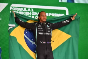 96196989 mercedes british driver lewis hamilton celebrates on the podium after winning brazils for