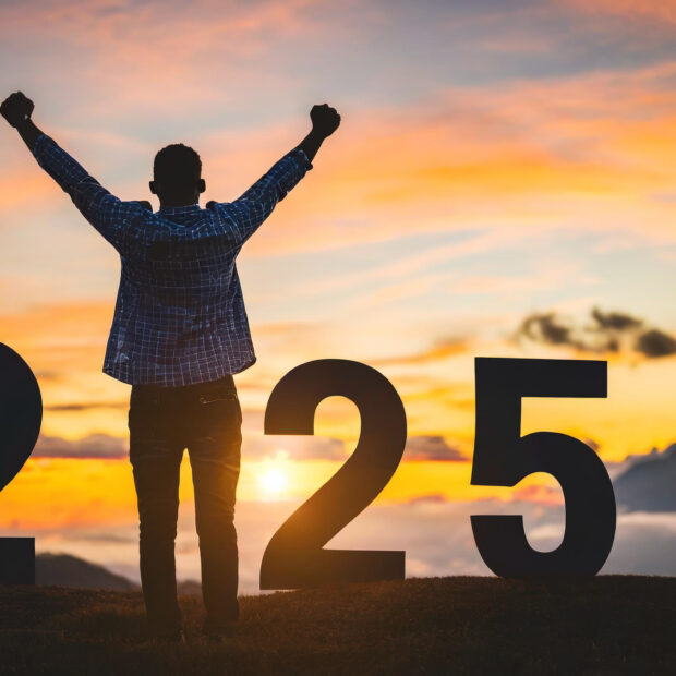 silhouette winning athlete against vibrant sunrise symbolizing new year 2025s fresh start m