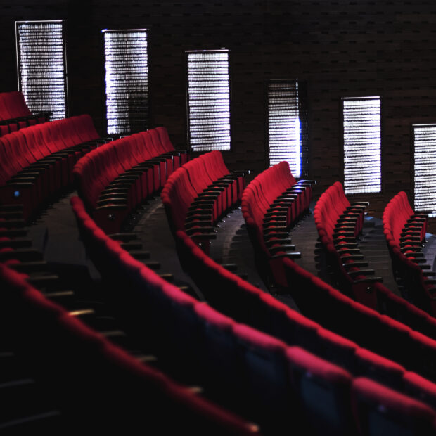 rows of red seats in a theater