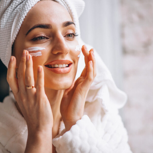woman applying face cream