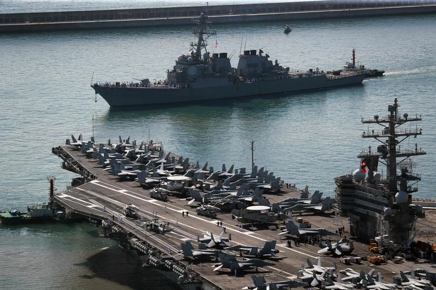 100594692 the us navys nuclear powered uss ronald reagancvn 76 aircraft carrier bottom and uss barr