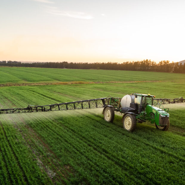 wide,angle,image,of,a,crop,spray,machine,spraying,chemicals