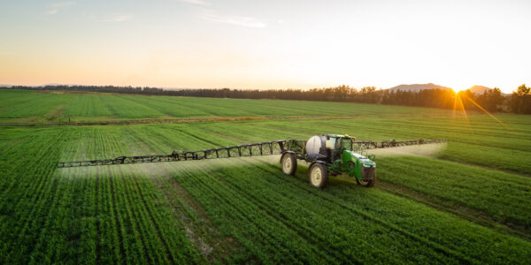 wide,angle,image,of,a,crop,spray,machine,spraying,chemicals