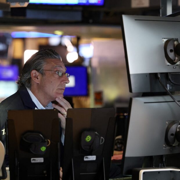 traders work on the floor of the new york stock exchange (nyse) at the opening bell ahead of fed's latest rate decision