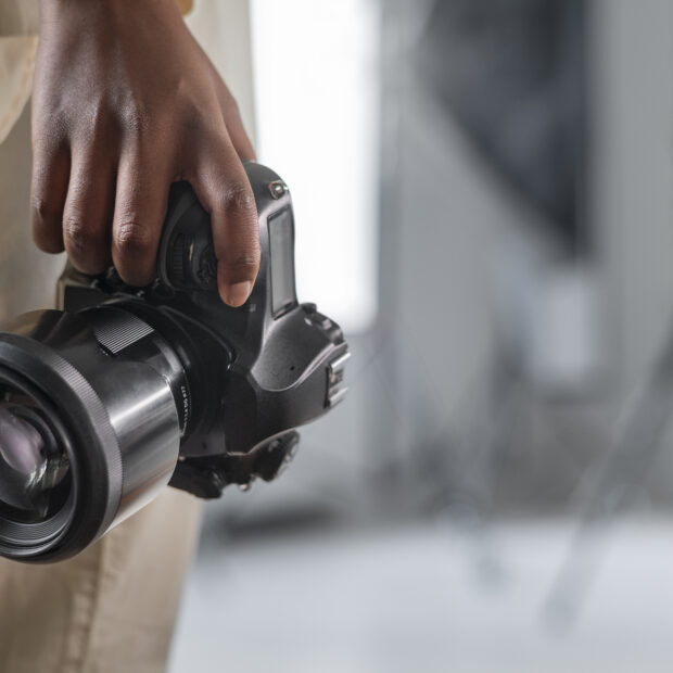 side view woman with photo camera