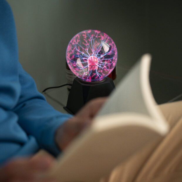 side view man with plasma ball