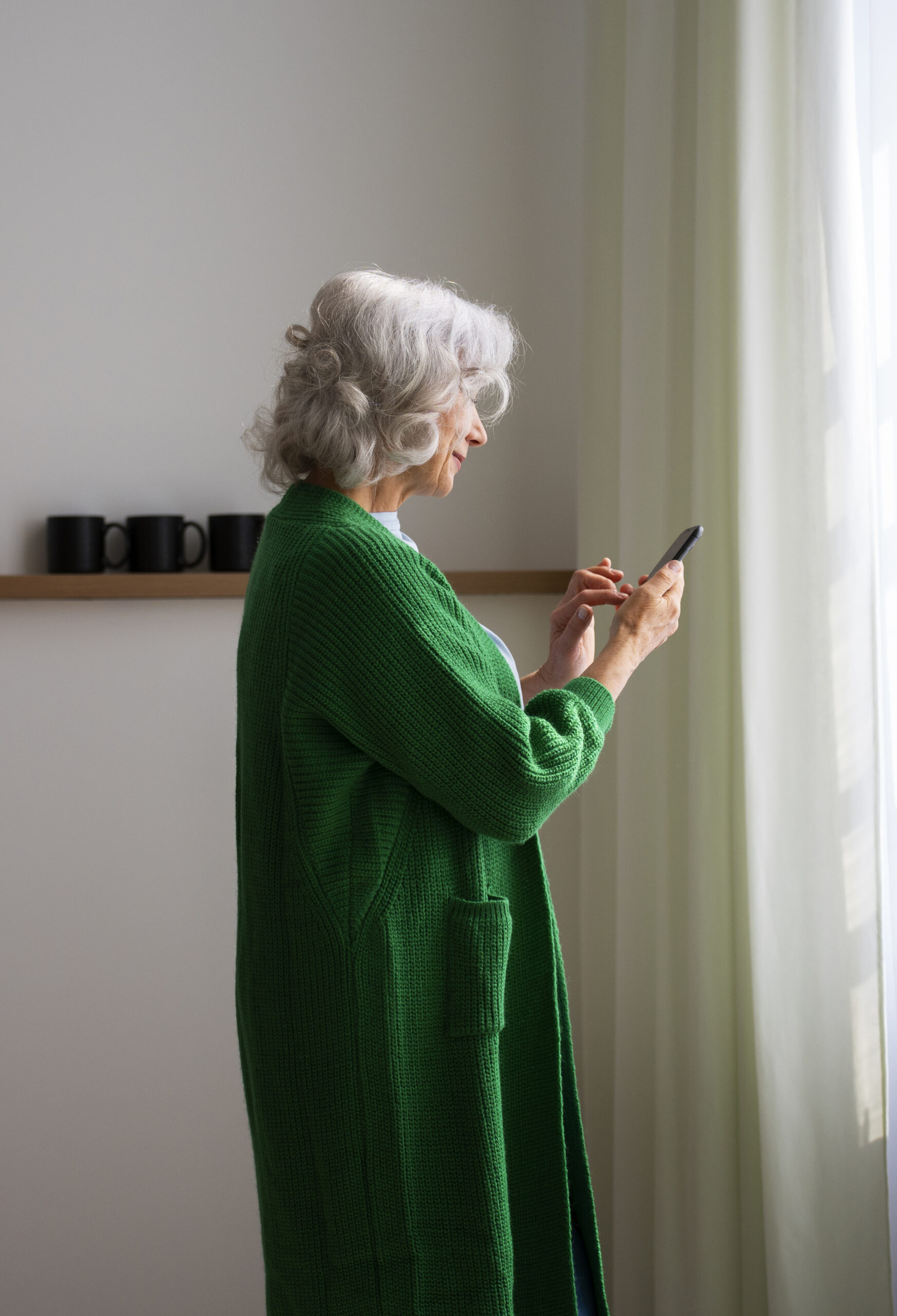 side view old woman spending time home