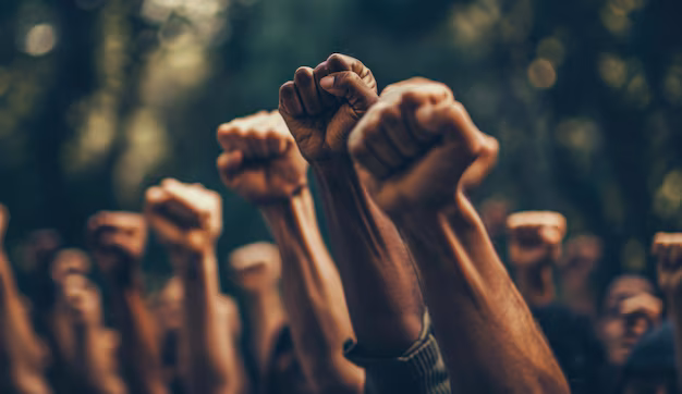 group people with raised fists 118124 112328