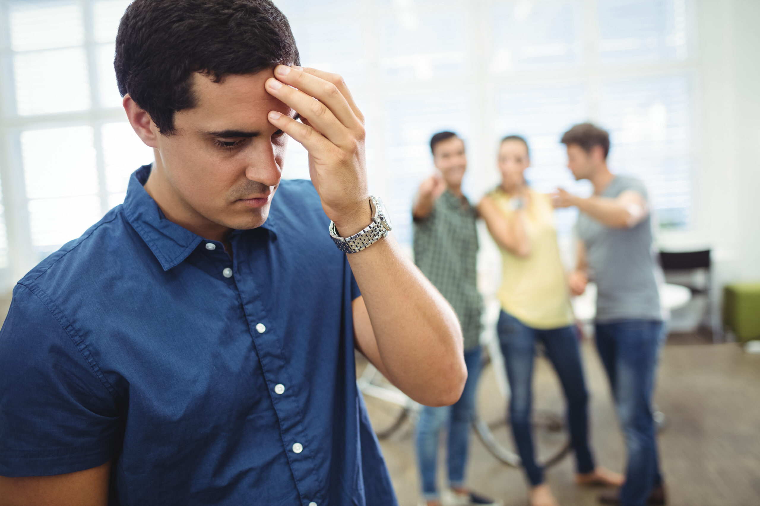 business executive making fun of colleague