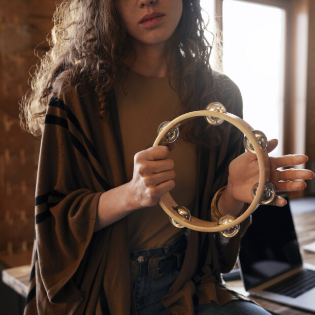 front view woman making music