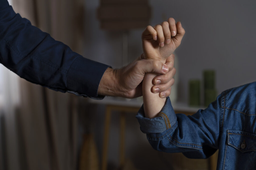 young child getting physical abuse from parent