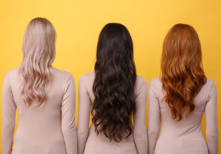 back view photo of young three ladies