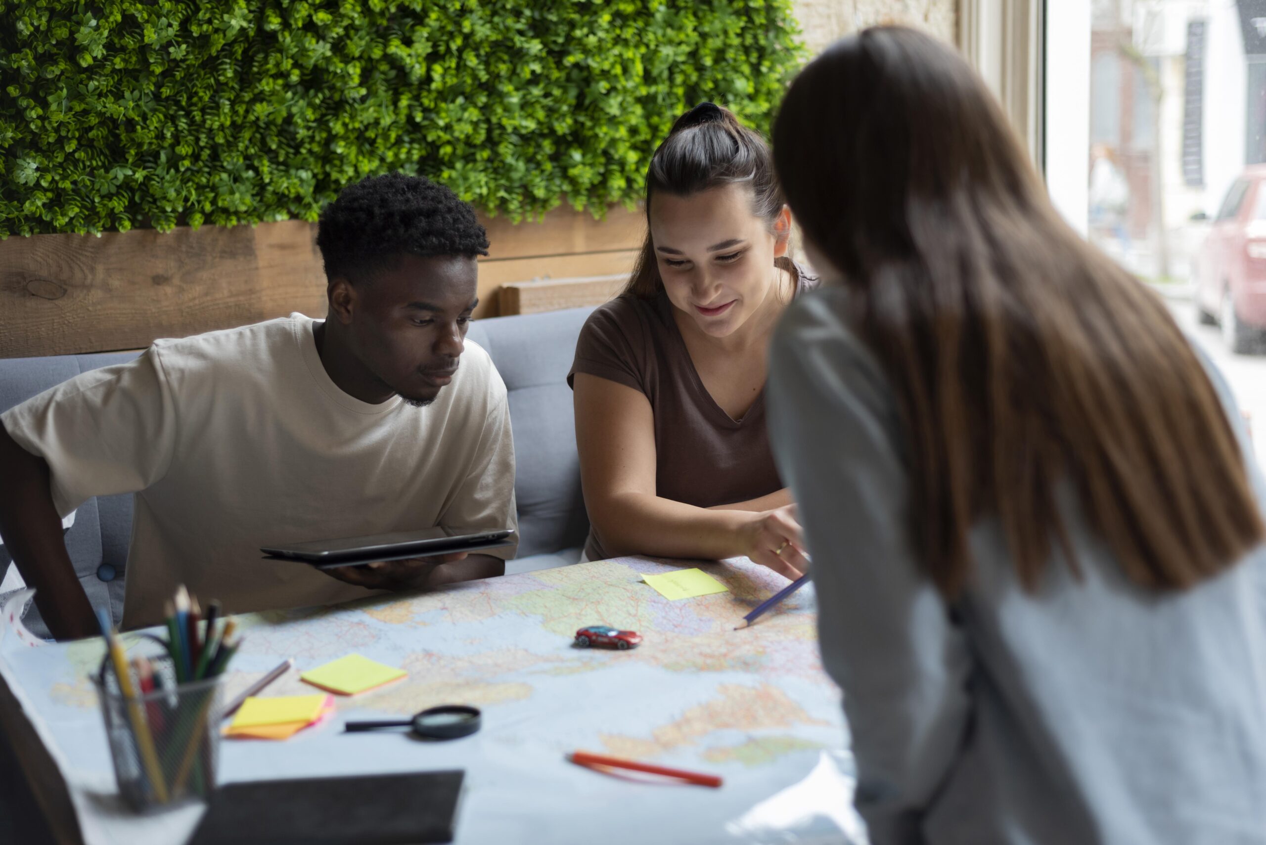 group friends planning trip cafe