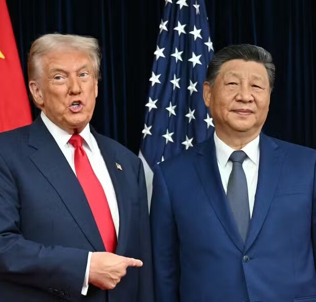 112859967 topshot us president donald trump l and chinas president xi jinping greet each othe