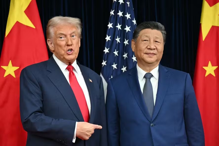 112859967 topshot us president donald trump l and chinas president xi jinping greet each othe