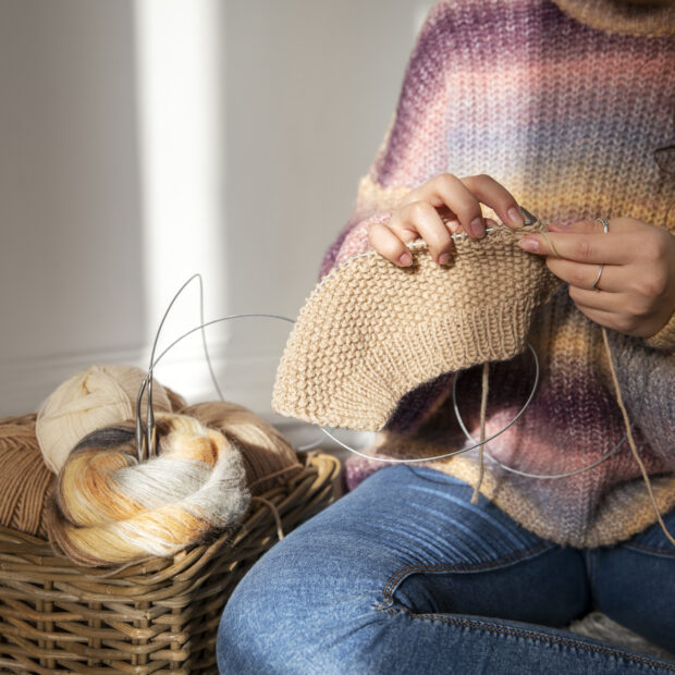 close up woman knitting floor