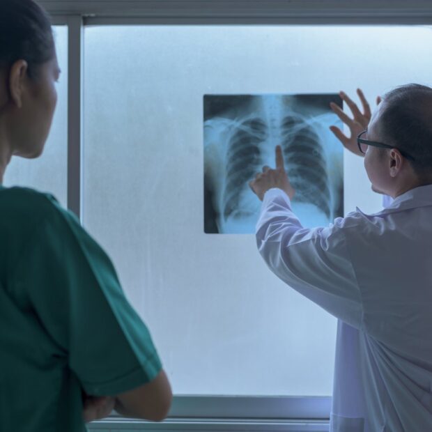 the doctor is analytic x ray film , showing to patient , health care concept