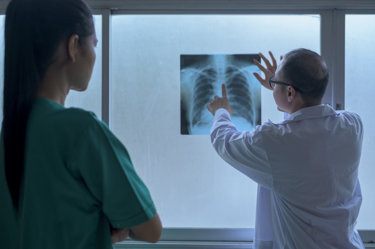 the doctor is analytic x ray film , showing to patient , health care concept