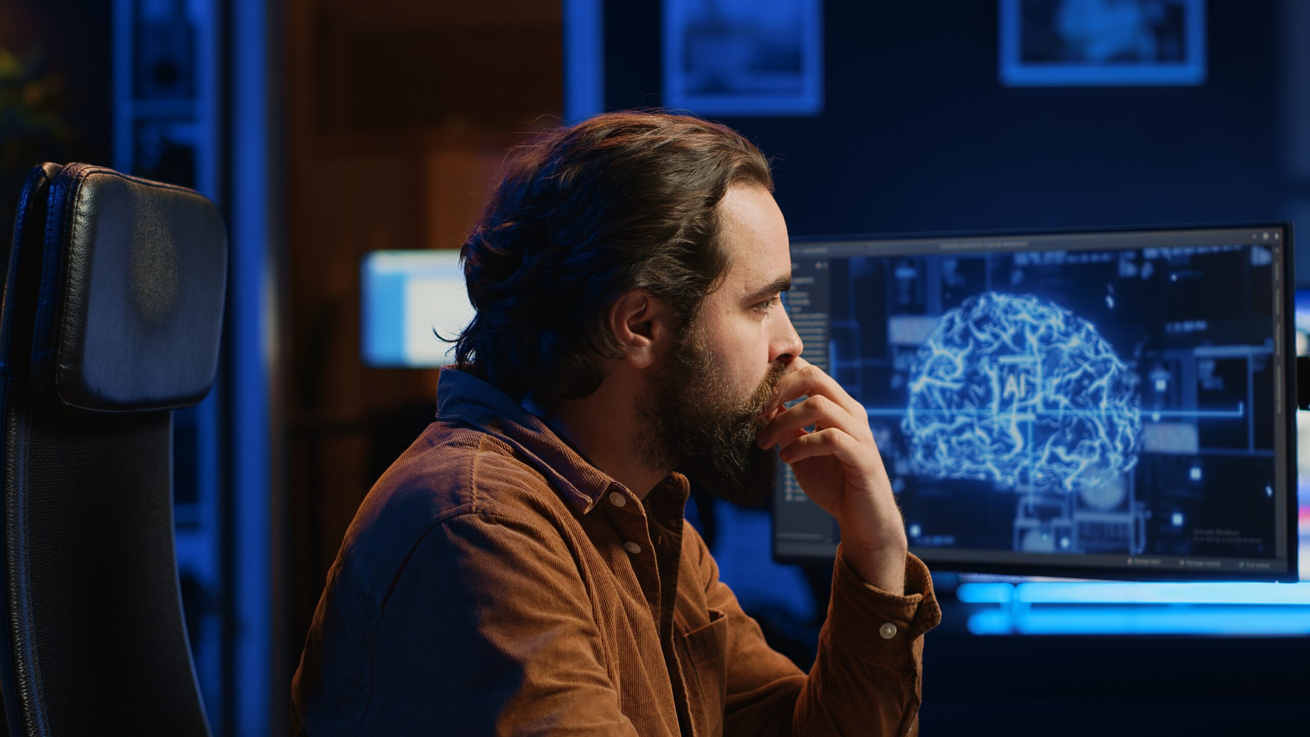 programmer using computer to update ai neural networks, drinking coffee