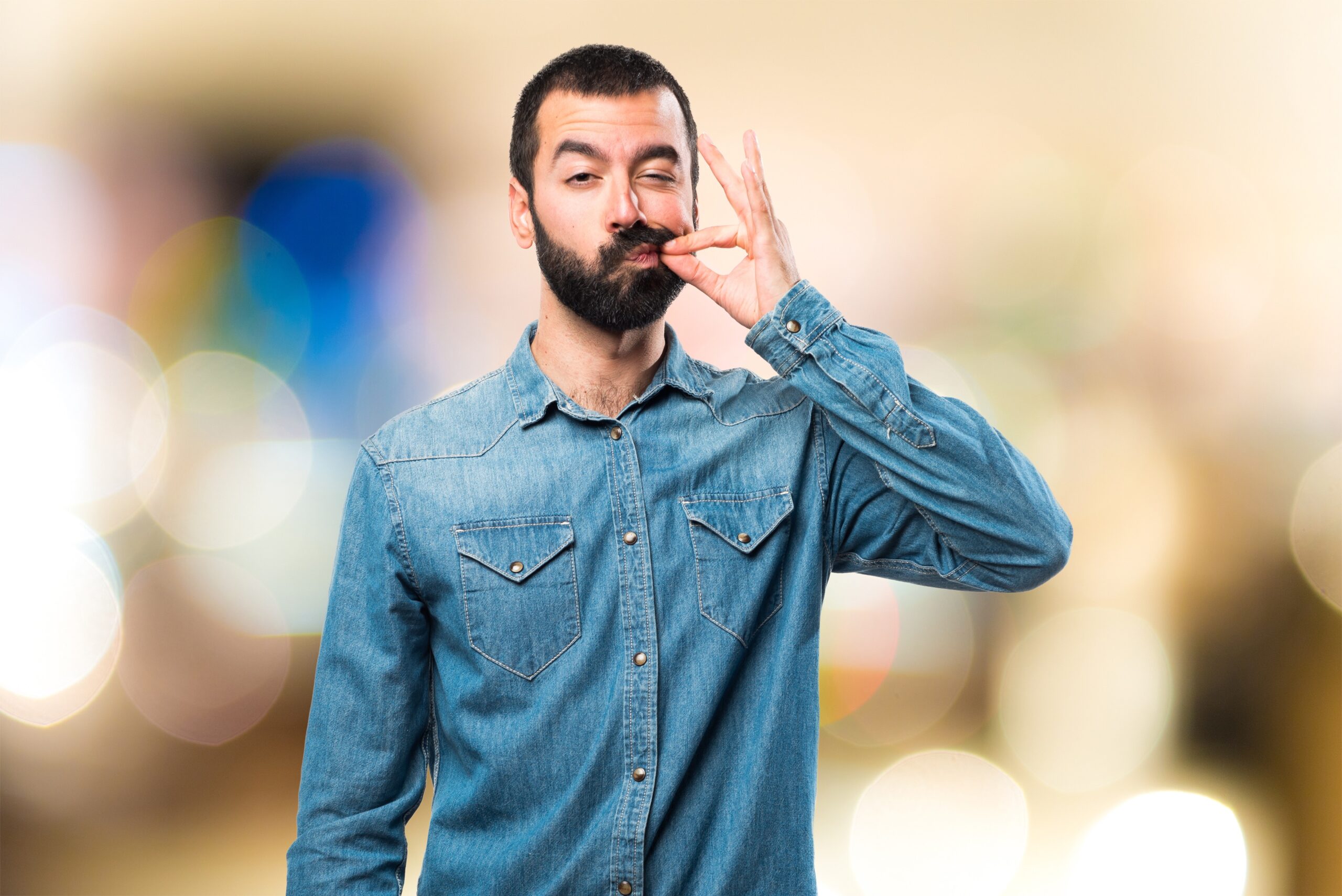 man making silence gesture