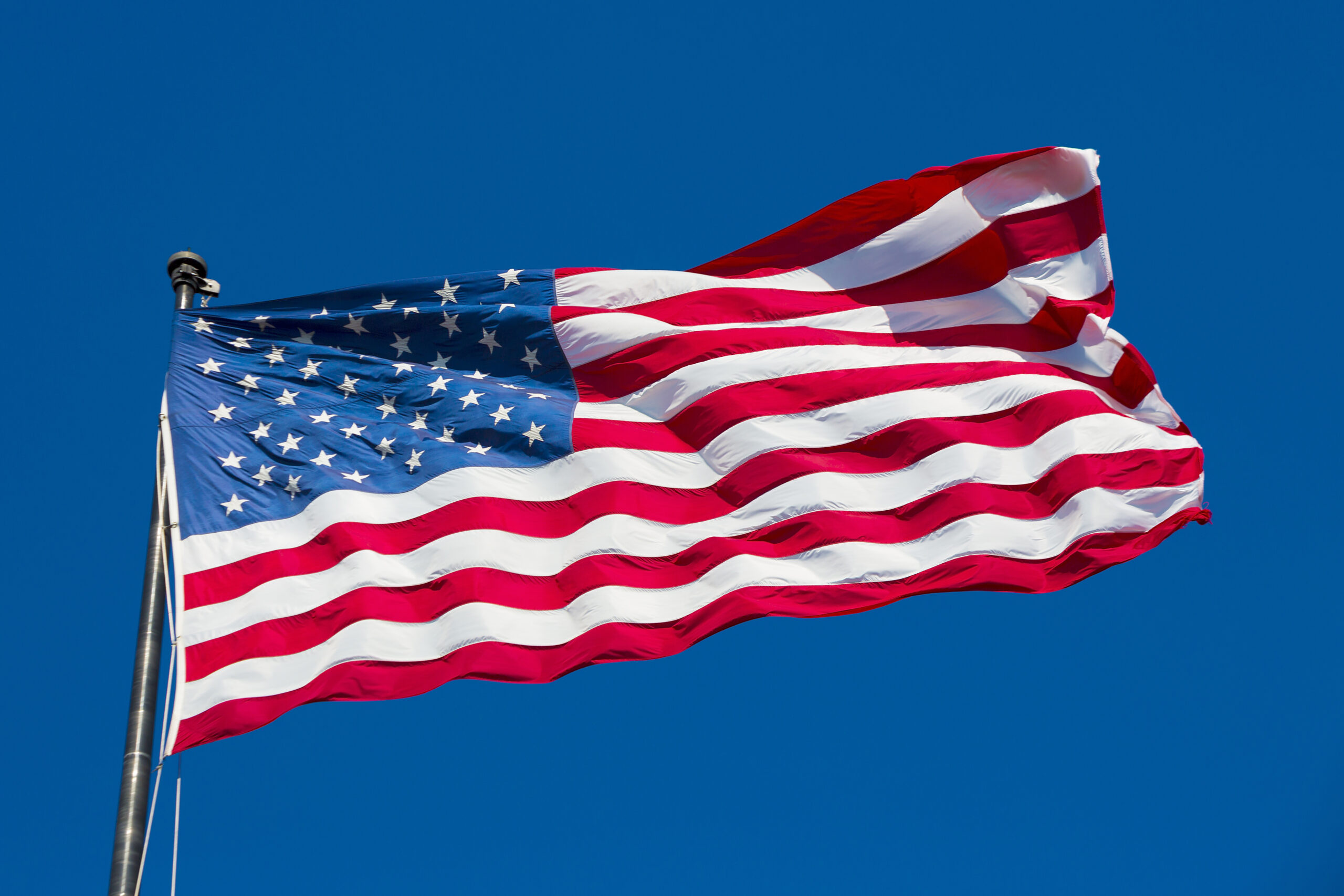 american flag and blue sky