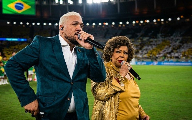 Entre falhas de áudio, desencontro musical e críticas da internet, a apresentação de Belo e Alcione no Maracanã dominou as conversas após a vitória do Brasil - Reprodução TV Globo