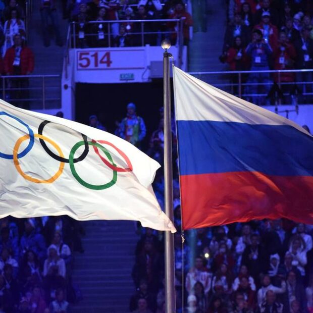 86076965 files in this file photo taken on february 23 2014 the olympic flag l and the russian f