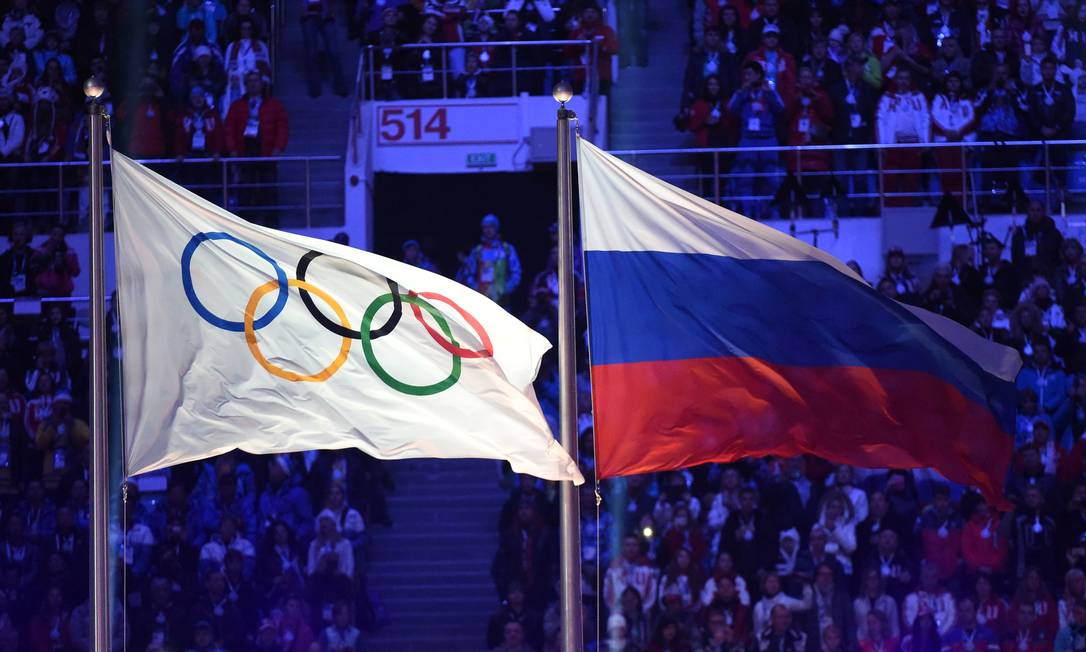 86076965 files in this file photo taken on february 23 2014 the olympic flag l and the russian f