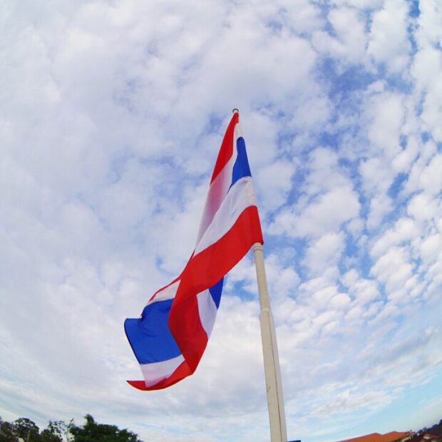 wide angle of the flag of thailand against the sky