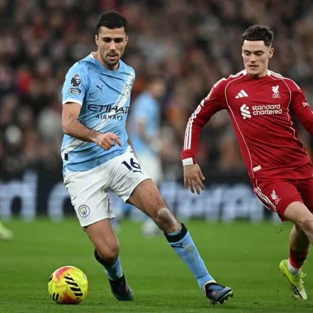 113790674 manchester citys spanish midfielder 16 rodri c is challenged by liverpools german midfi