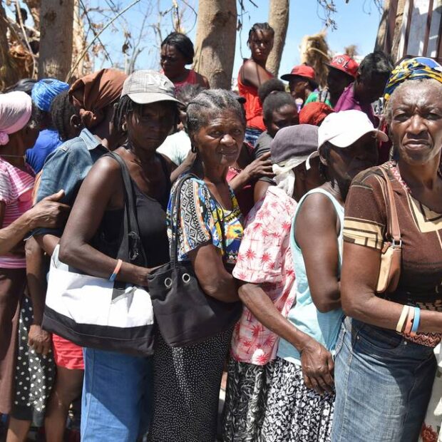 62099801 hurricane matthew victims wait to receive food from the uns world food programme in ro