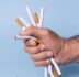 close up hand holding cigarettes