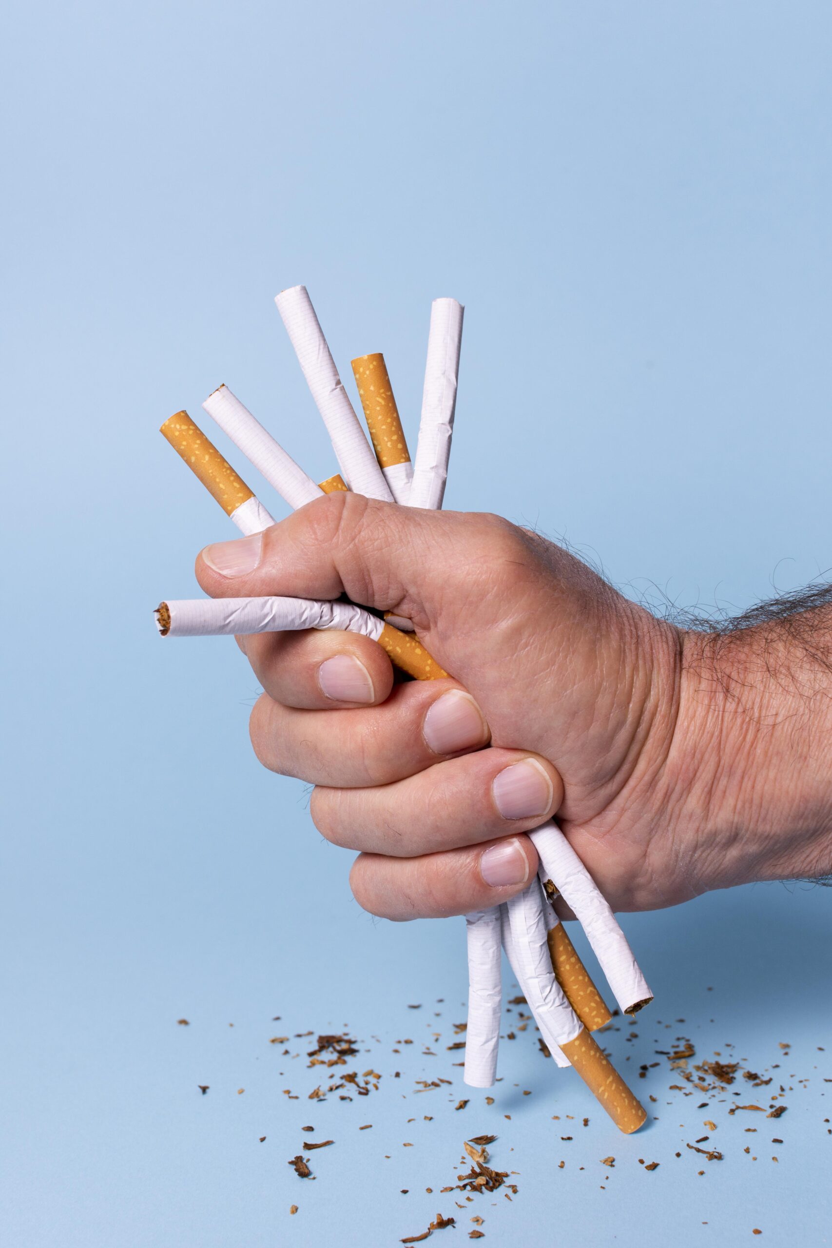 close up hand holding cigarettes