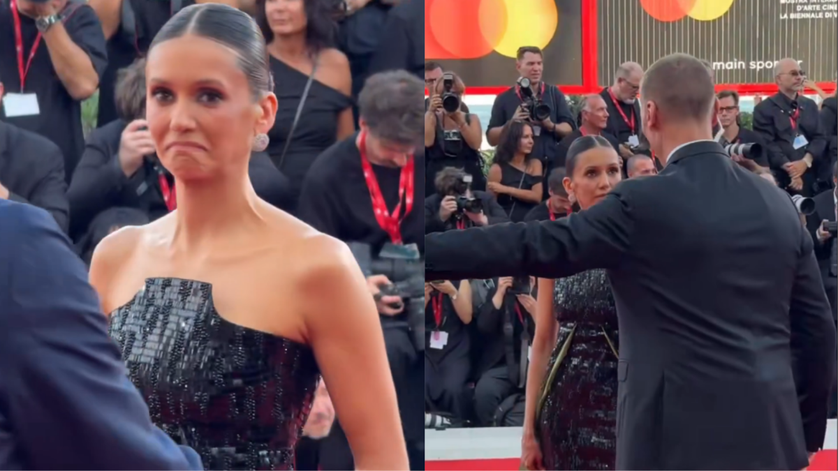 Nina Dobrev viveu um climão no Festival de Veneza ao ser interrompida por um segurança enquanto posava para os fotógrafos.