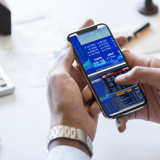 businessman checking stock market online