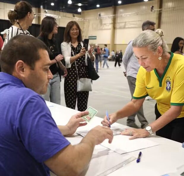 116465192 brazilian nationals have their identification verified at a polling location before vo 1
